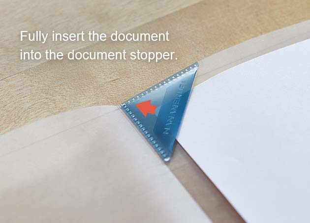 Fully insert the document into the document stopper.